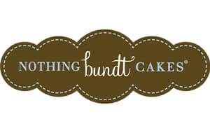 Logo of Nothing Bundt Cakes featuring stylized text. The design includes a wavy border in a brown color, with 'NOTHING' in white writing and 'bundt' in cursive. The word 'CAKES' is also included in a smaller font. The logo emphasizes a baked goods theme.
