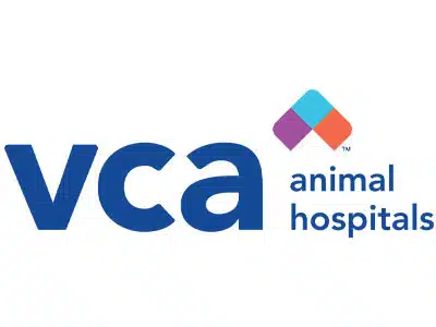 Logo of VCA Animal Hospitals featuring the letters ‘vca’ in blue and the words ‘animal hospitals’ in a smaller font below. The logo includes a colorful diamond shape in turquoise, orange, and purple on the upper right side.