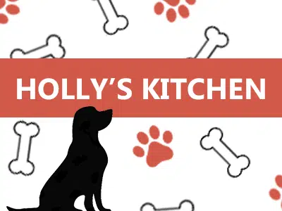 A graphic design featuring the text "HOLLY'S KITCHEN" in bold white letters on an orange background. The background displays various outlined dog bones and paw prints in red and gray. A black silhouette of a dog is positioned to the left of the text.