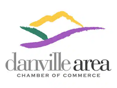 Logo of the Danville Area Chamber of Commerce featuring stylized mountains in green, yellow, and purple, above the text "danville area" in bold black letters, followed by "CHAMBER OF COMMERCE" in smaller capital letters.