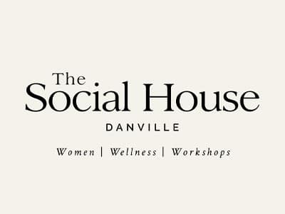 A logo for The Social House in Danville, featuring elegant typography. The text reads 'The Social House' prominently at the top, with 'DANVILLE' below it. Additional phrases 'Women | Wellness | Workshops' are displayed at the bottom.