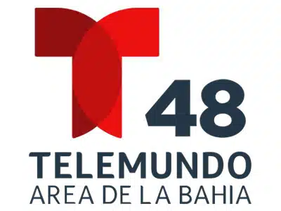 A logo for Telemundo 48, featuring a stylized letter 'T' in red, overlaid with curved shapes, and the number '48' in dark blue. Below, the text reads 'Telemundo Area de la Bahía' in dark gray.