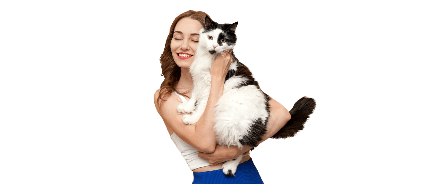 A smiling woman holding a black-and-white cat, cut out on a transparent background for Joybound.